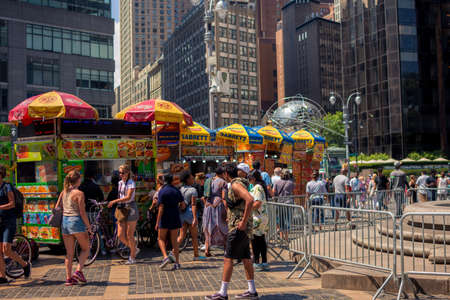 New York, NY / USA - July 24, 2019: Columbus Circle Vendors With Globe Statue In Background Near...