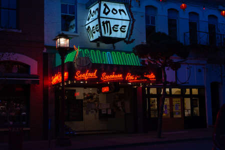 Neon signs on the facade of a cafe in New Orleans.