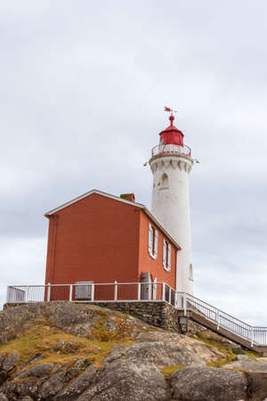 Lighthouse on the coast of Atlantic ocean in Newfoundland and Labrador, Canadaの写真素材