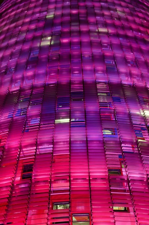BARCELONA, CATALONIA, SPAIN - OCTOBER 19: The AECC organized "Join the Pink" at the global day against breast cancer. The Agbar Tower is illuminated pink on October 19, 2011 in Barcelona, Spainのeditorial素材