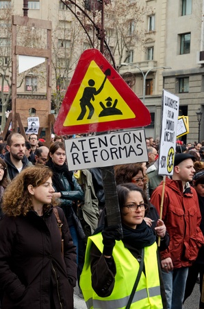 BARCELONA, SPAIN - FEBRUARY 19: hundreds of thousands of people across Spain demonstrate against the conservative governments new labor laws. Passeig de Gracia on February 19, 2012 in Barcelona, Spainのeditorial素材