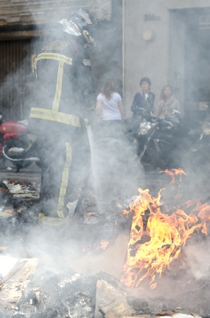 BARCELONA, SPAIN - MARCH 29: One of the multiple fires caused by heavy riots during nationwide spanish general strike against labour reforms in the city center of Barcelona on March 29, 2912.のeditorial素材
