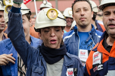 About 25,000 miners and residents of the miners zone of Asturias demonstrate against close-downs and financial cuts in the carbon sector on June 18th, 2012 in Langreo, Spainのeditorial素材