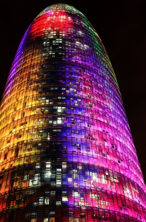 Barcelona, Spain. 12th December 2012: The Torre Agbar pictured lit up for the Christmas season with more than 4,500 lights that can operate independently using LED technology displaying a seasonal design out of moving lights and colorsのeditorial素材
