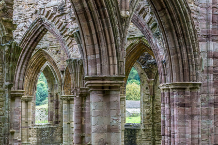 Arches and columns of the Tintern Abbey church, first Cistercian foundation in Wales, dating back to a.d. 1131のeditorial素材