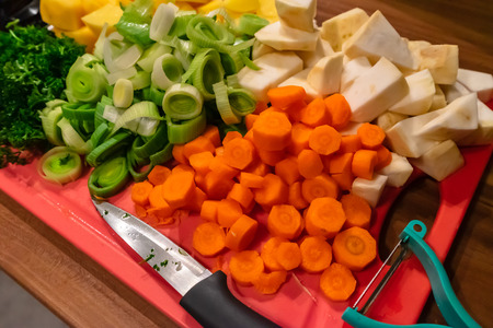 Vegetables cut on a chopping boardの写真素材