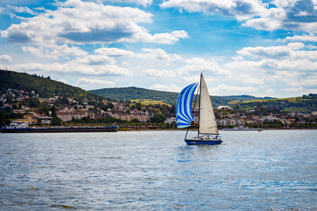 Sailboat on the rhine in front of the city Bingen.の写真素材