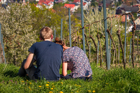 Couple sitting in an vineyard.の写真素材
