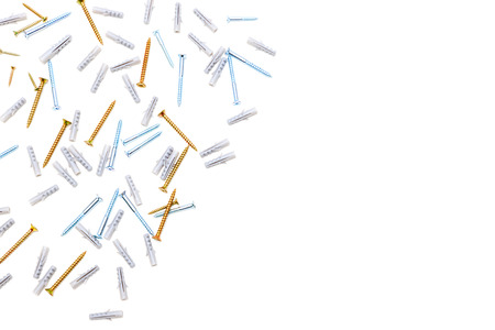 Screws and dowels on white background.の写真素材