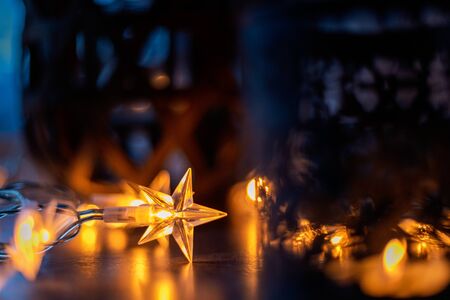 Light chain and candles create a cosy atmosphere. Romantic. Christmasの写真素材