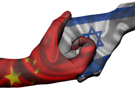 Diplomatic handshake between countries: flags of China and Israel overprinted the two handsの写真素材