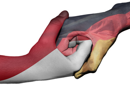 Diplomatic handshake between countries: flags of Indonesia and Germany overprinted the two handsの写真素材