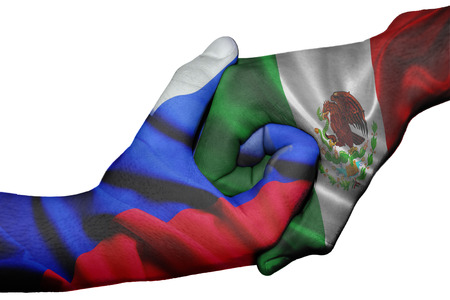 Diplomatic handshake between countries: flags of Russia and Mexico overprinted the two handsの写真素材