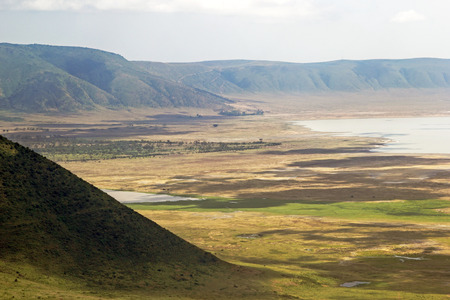 Panoramic view of crater and rim of Ngorongoro Conservation Area, Tanzania. Lake Magadi is also visible on the right.の写真素材