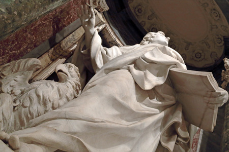 Statue of John the Evangelist into a niche in the Archbasilica of St. John Lateran, Rome Italyのeditorial素材