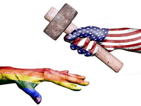Flag of United States overprinted on a hand holding a heavy hammer hitting a hand representing the Peace. Conceptual image for political, fiscal or social aggressions, penalties, taxationの写真素材