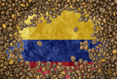 National country flag of Colombia under a background of roasted brown coffee beansの写真素材