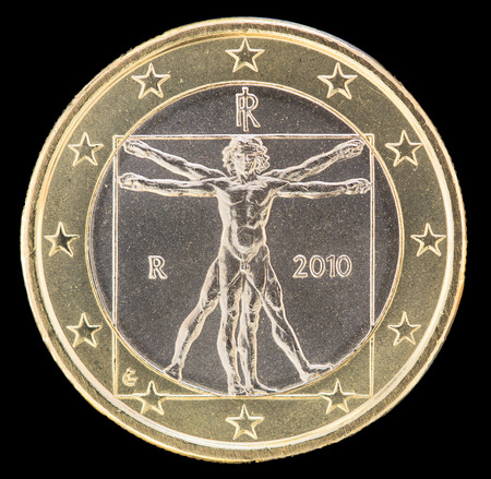 National side of one euro coin issued by Italy isolated on a black background. The italian obverse face depicts the vitruvian man drawn by Leonardo da Vinci to illustrate ideal proportions of human bodyの写真素材