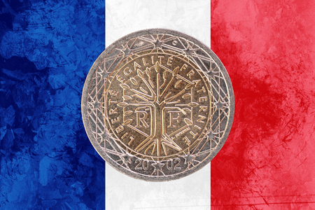 Two euros coin from France isolated on the national french flag as backgroundの写真素材
