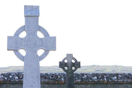 View on white and black old Celtic tombstones against of landscapeの写真素材