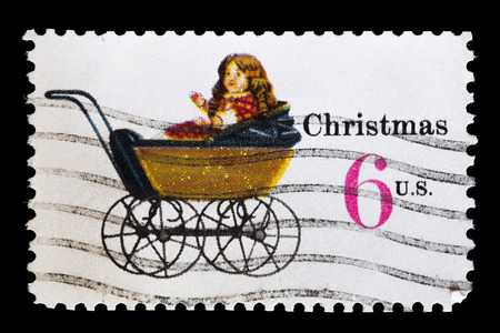 UNITED STATES OF AMERICA - CIRCA 1970: A used postage stamp printed in United States shows a doll carriage to depict Children's Toys for Christmas, circa 1970のeditorial素材