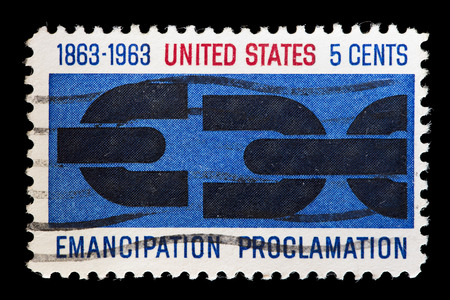 UNITED STATES OF AMERICA - CIRCA 1963 : A used postage stamp printed in United States shows a broken chain to commemorate the Anniversary of Emancipation Proclamation, circa 1963のeditorial素材