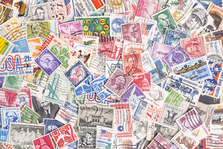 Background of many used postage stamps from United Statesの写真素材