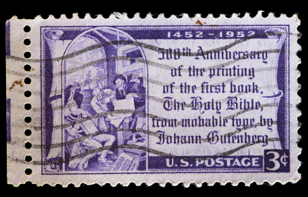 UNITED STATES OF AMERICA - CIRCA 1952: A used postage stamp printed in United States shows a reproduction from the first printed Bible in 1452, first major book printed using mass-produced movable type by Johannes Gutenberg, circa 1952のeditorial素材