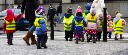 young children walking on a school trip to Pragueの写真素材