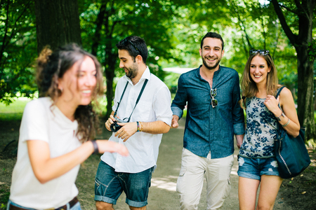 Group of Friends Talking in the Parkの写真素材