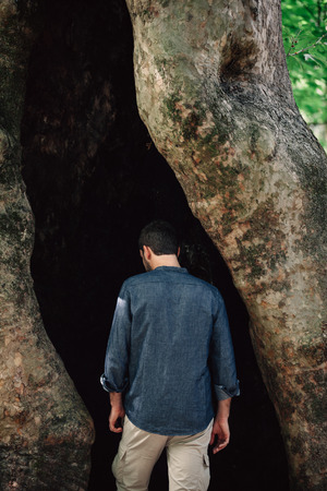 Handsome Man Portrait into a Hallow Threeの写真素材