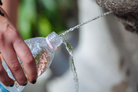 Filling Up a Plastic Bottle With Fresh Water