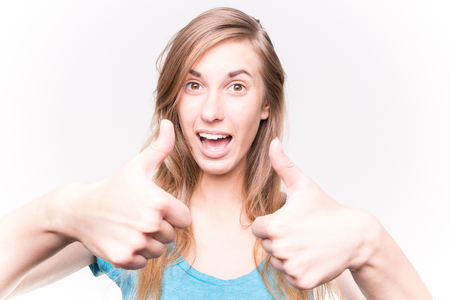 Young Woman smiling and Thumbs Upの写真素材