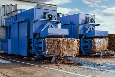 blue paper squeezer container and garage press machine recycle cardboard to reusable material bales