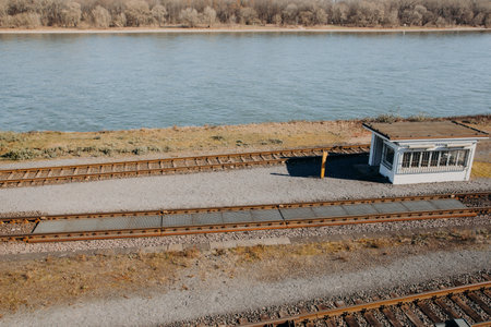 Rail Scales for static and coupled in motion weighing with station house next to river