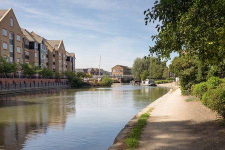 Hemel Hempstead, UK - September 01, 2016: View over canal looking onto new apartment buildings in the popular Apsley areaのeditorial素材