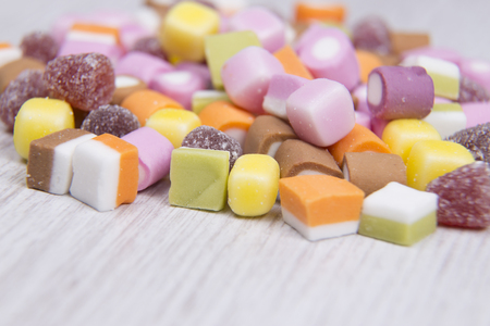 Shallow focus of candy on a white surfaceの写真素材
