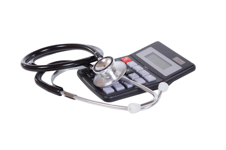 Medical stethoscope and calculator on white conceptual of the costs of healthcare, medicine and hospitalisationの写真素材