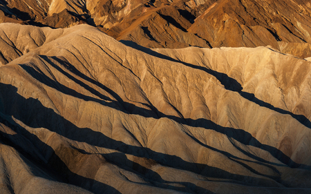 Zabriskie Point badlands at sunrise in summer, Death Valley National Park (California).の写真素材