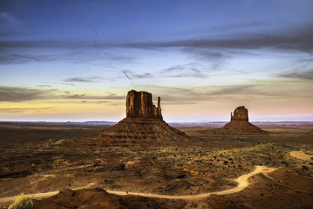 The West and the East Mitten Buttes in the Navajo Tribal Valley Monument in summer during a bright...