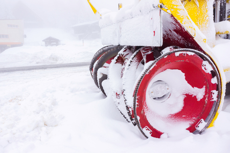 Closeup of the auger of a snowy snow plow with copy space - Vosges (France) - december 2017の写真素材