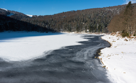 Frozen Lauch Lake in winter during a sunny morning - Vosges, France - december 2017の写真素材