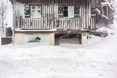 An abandoned and torn house covered in snow - Vosges, Franceの写真素材