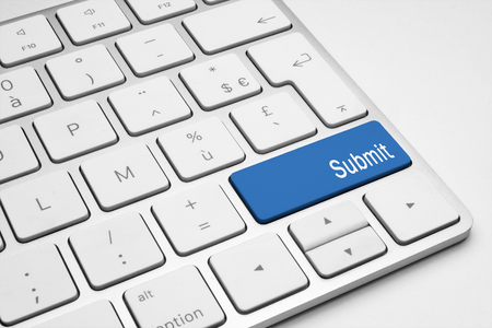 Blue Submit button on a white keyboard