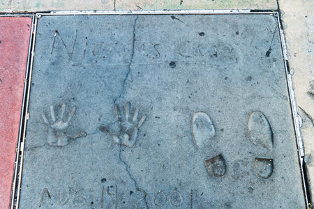 Nicolas Cage on the ground behind TCL Grauman 's Chinese Theater, Hollywood Boulevard, Los Angeles, California.のeditorial素材