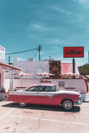 The historic Ford Fairlane Victoria Crown (1955) parked in front of the Route 66 Place and Twisters, Williams, Arizona.のeditorial素材