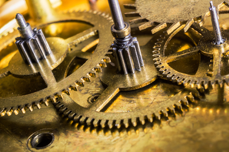 Beautiful macro close-up on clockwork mechanism with gears. Illustrative concept of machinery, technology engineering, thinking, intellectual concept.の写真素材