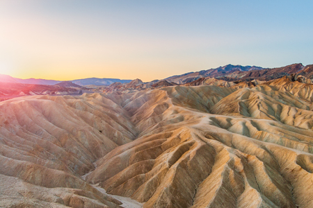 Beautiful landscape of mudstone badlands at Zabriskie Point at sunrise in summer, Death Valley National Park, California, USA.の写真素材
