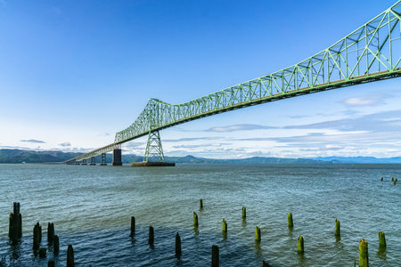 ASTORIA, OREGON - JUNE 6, 2018: Astoria Megler Bridge over the Columbia River seen from Astoria waterfont, Oregon Coast, US route 101, USA.のeditorial素材