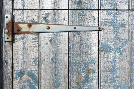 Strap hinge on old wooden stable door.